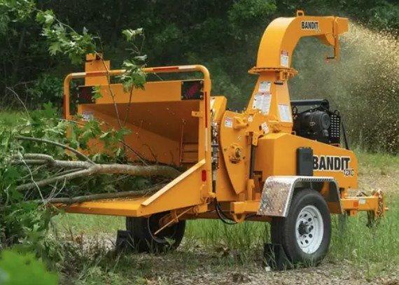 Bandit wood chipper clearing brush
