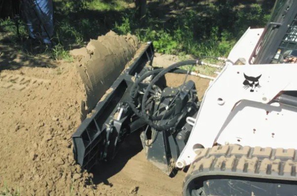 Dozer blade attachment grading dirt